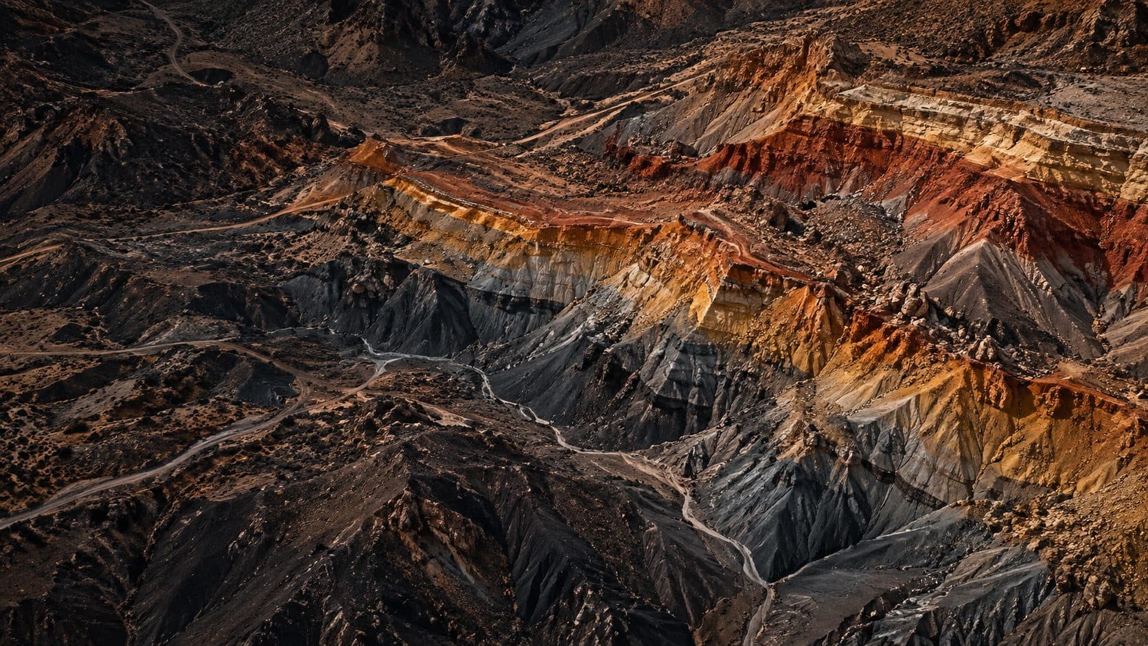 Aerial view of colorful eroded rock strata